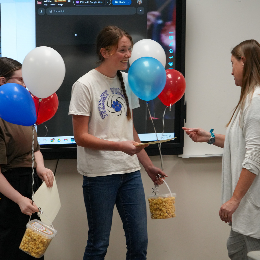 Student smiles as the award is presented