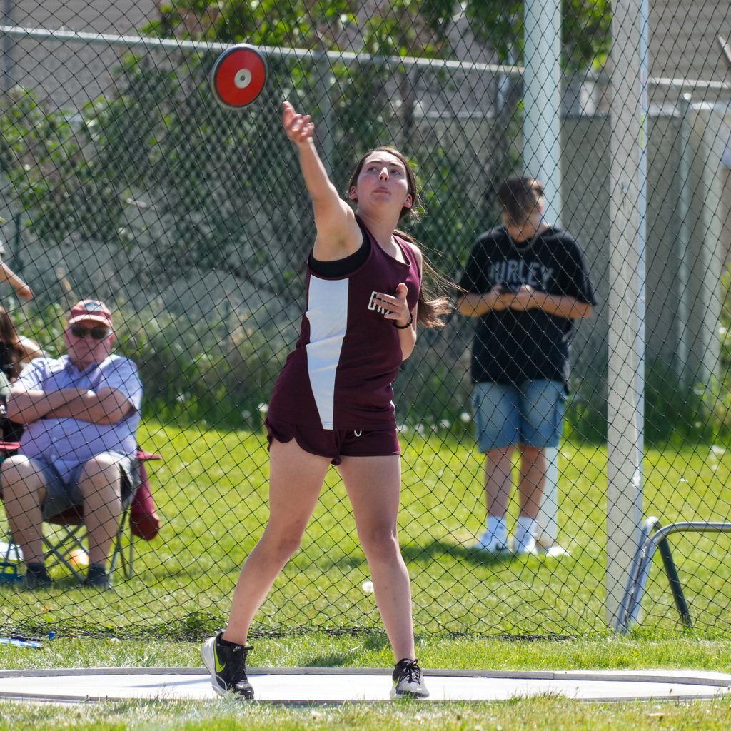 A Rocky Mountain girl's track athlete throws the discus