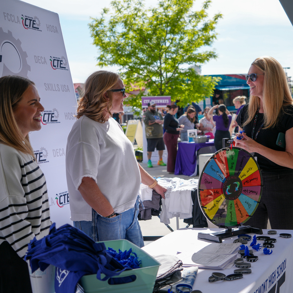 People around a booth at the event