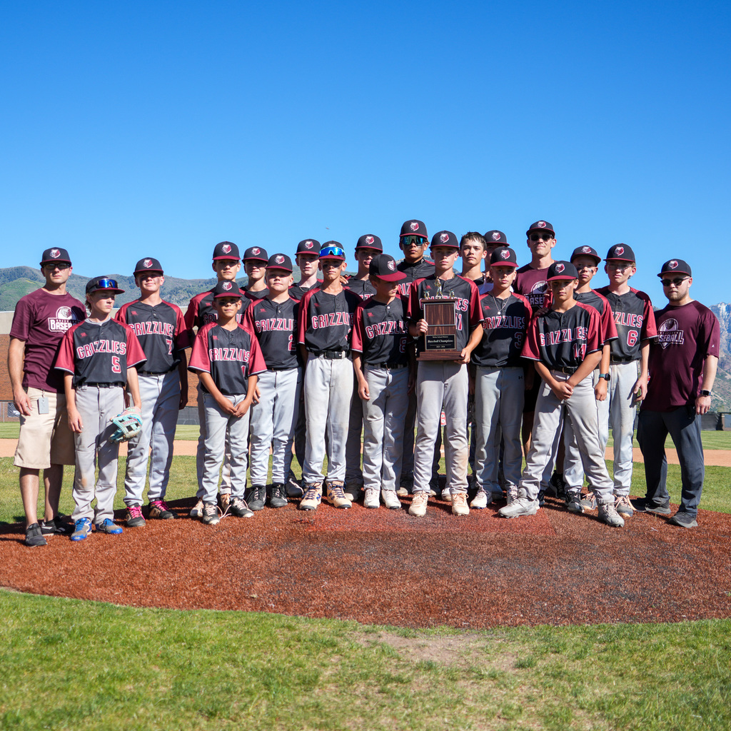 Rocky mountain team on the pitcher's mound with the trophy