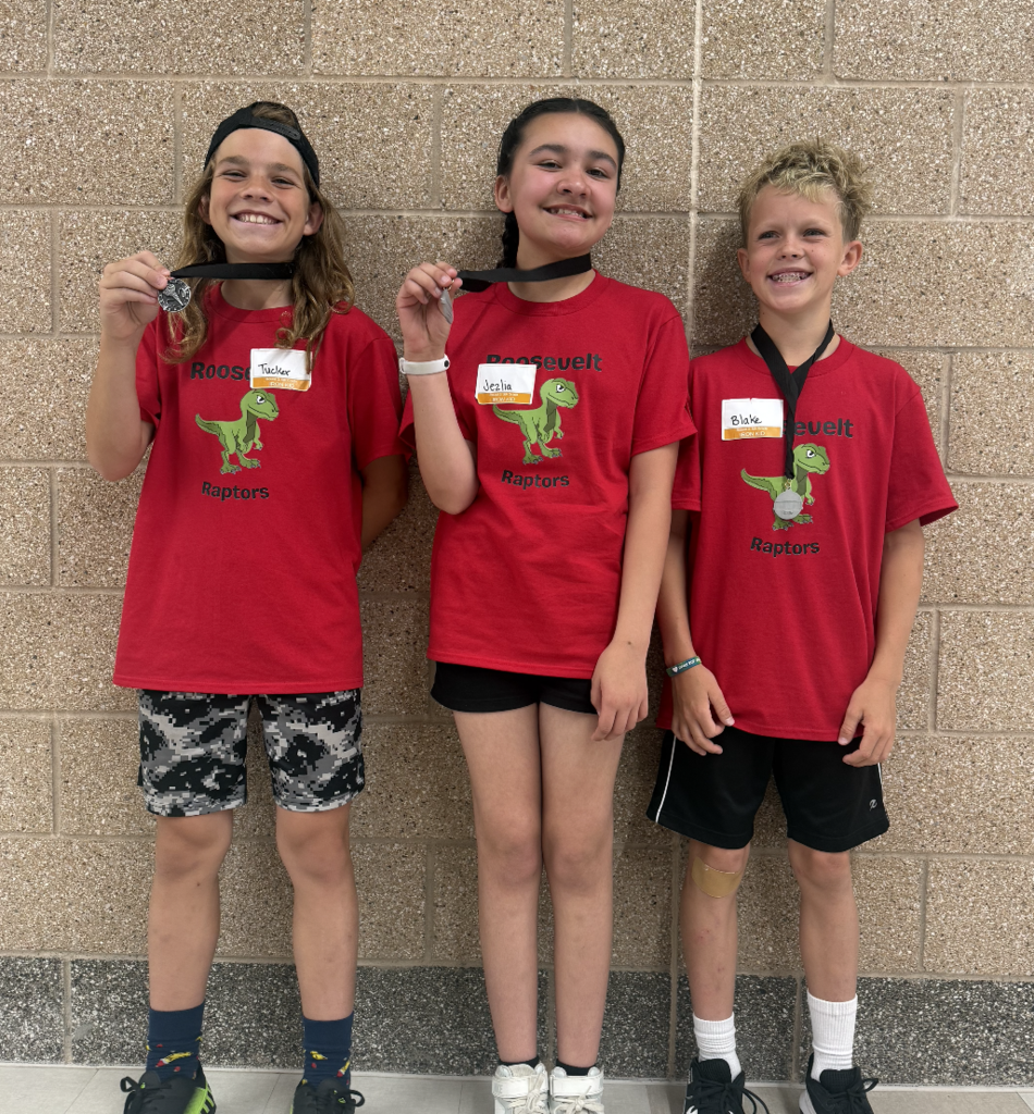 5th grade iron kid team standing together showing their medals