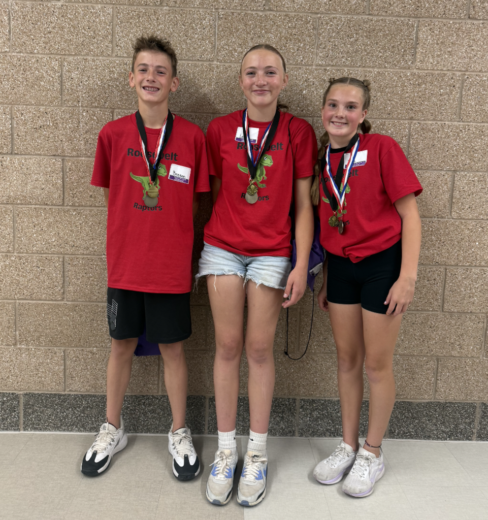 6th grade iron kid team standing together showing their medals