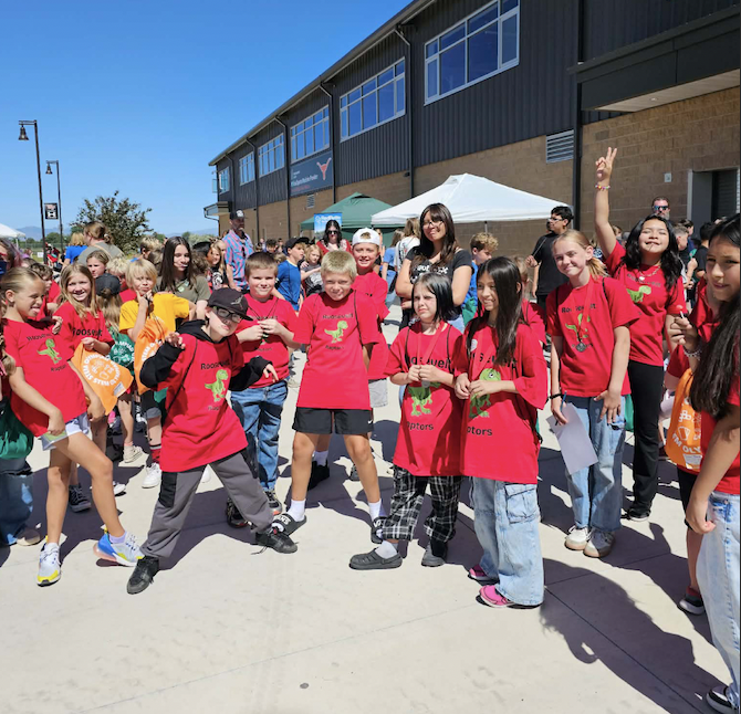 students at the STEM olympiad together as a group being silly