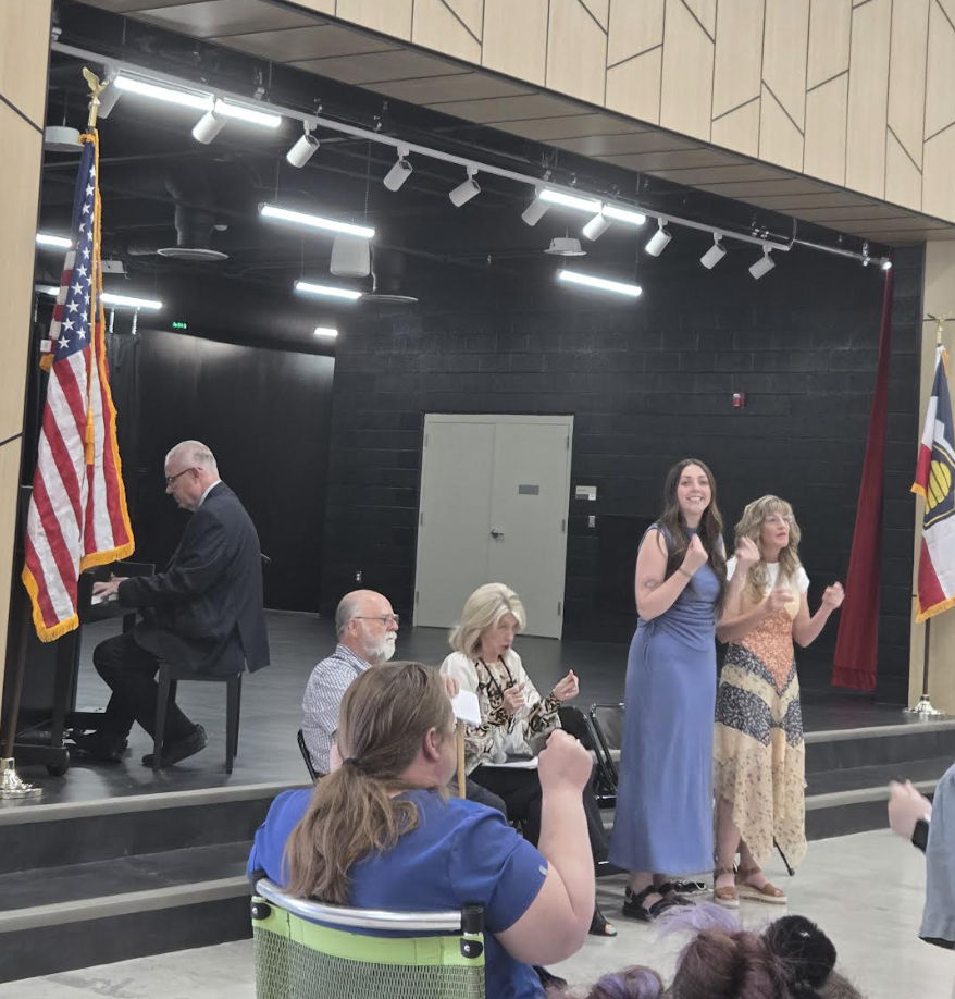 teachers singing the Raptor song