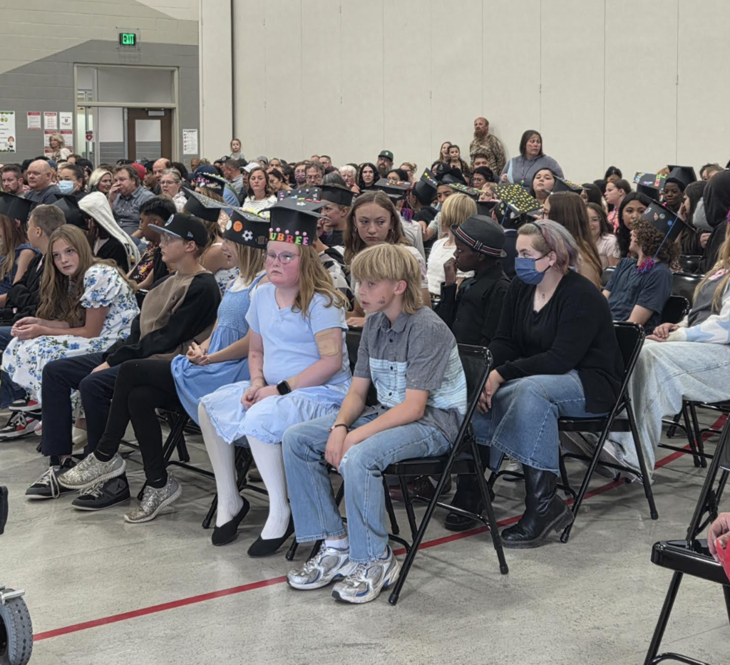 students sitting in the 6th grade graduation