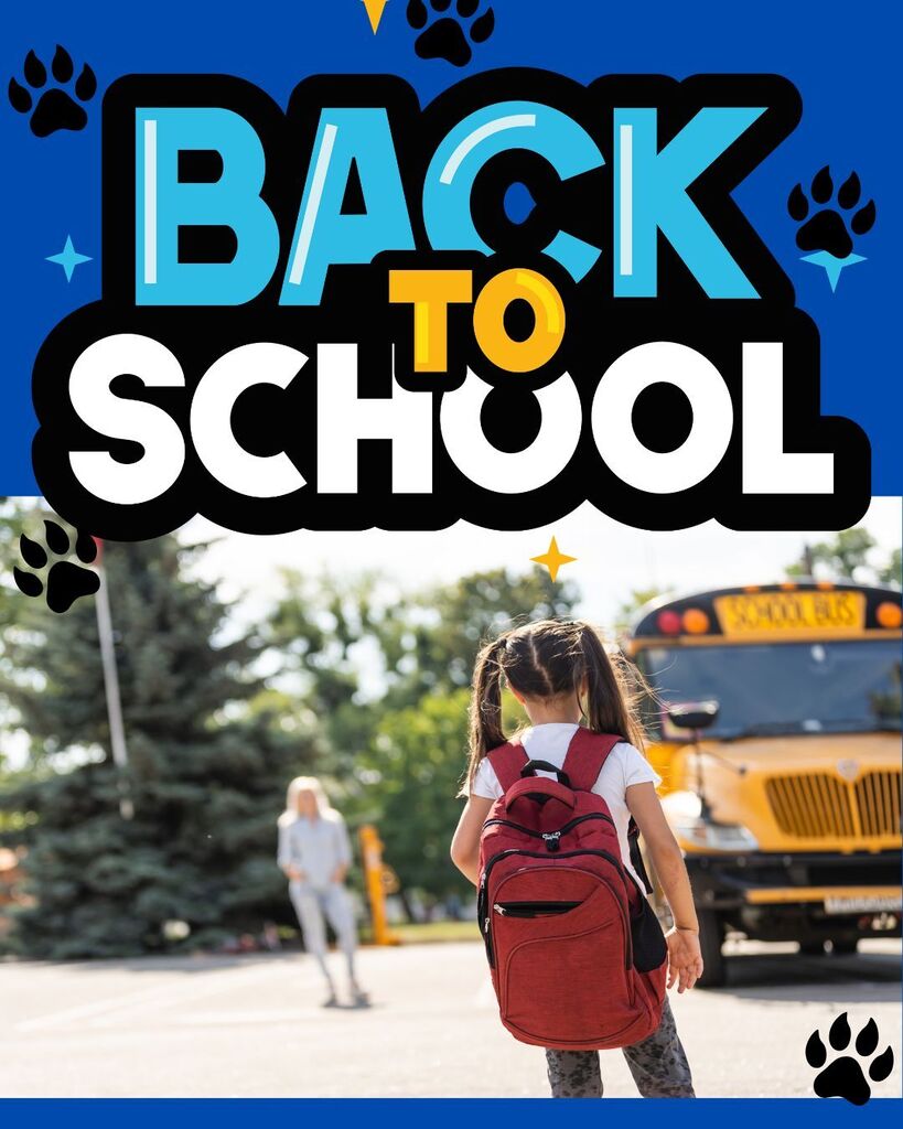 stock photo of a littler girl looking at a bus: with writing BACK TO SCHOOL