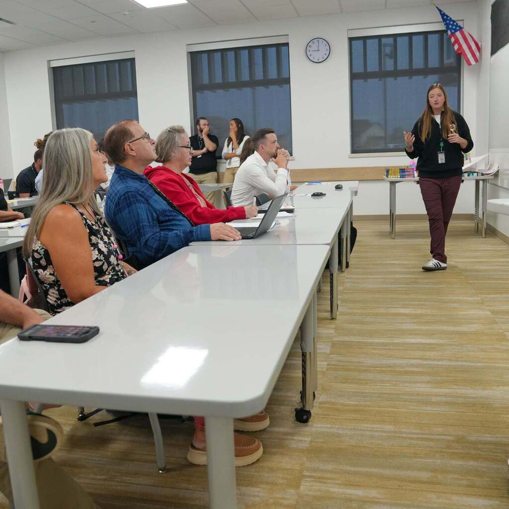 Teacher in front of class teaching teachers.