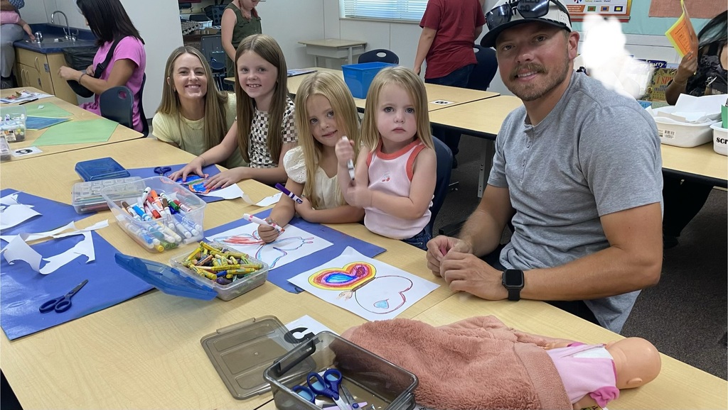 parents and students enjoy creating in the art room during back to school night