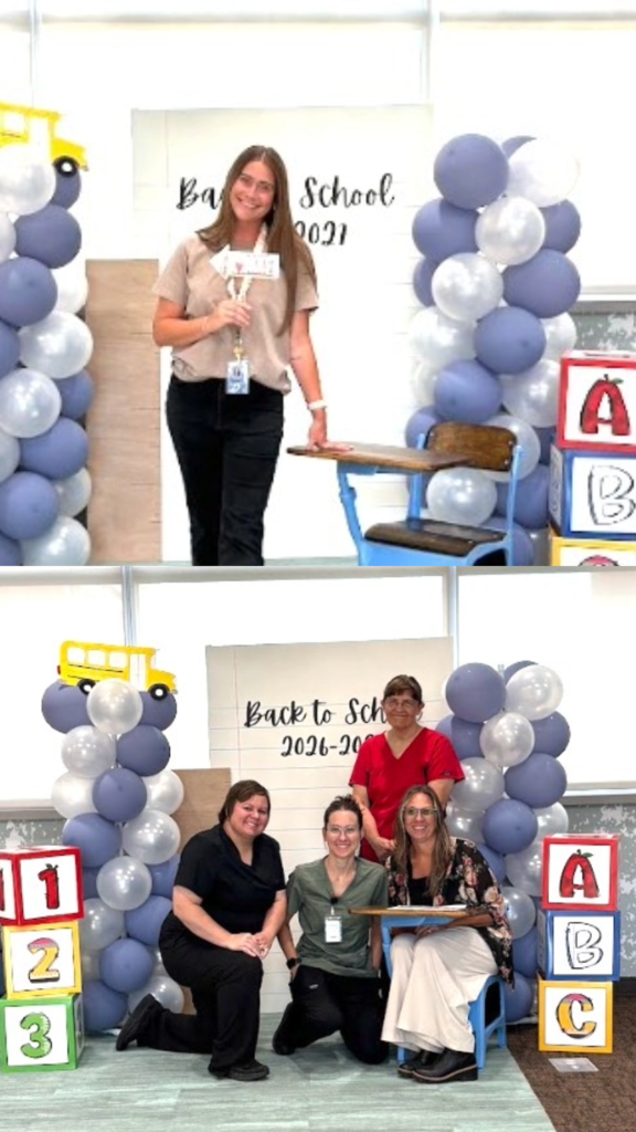 Top Photo: A woman in a beige top and black pants smiling while holding a prop sign next to a blue school desk in front of a backdrop reading "Back to School 2021".  Bottom Photo: Four staff members posing in front of a backdrop reading "Back to School 2026-2027"—two kneeling in medical scrubs and two seated at a desk—framed by blue balloon columns, a school bus cut-out, and stacked 123 and ABC blocks.