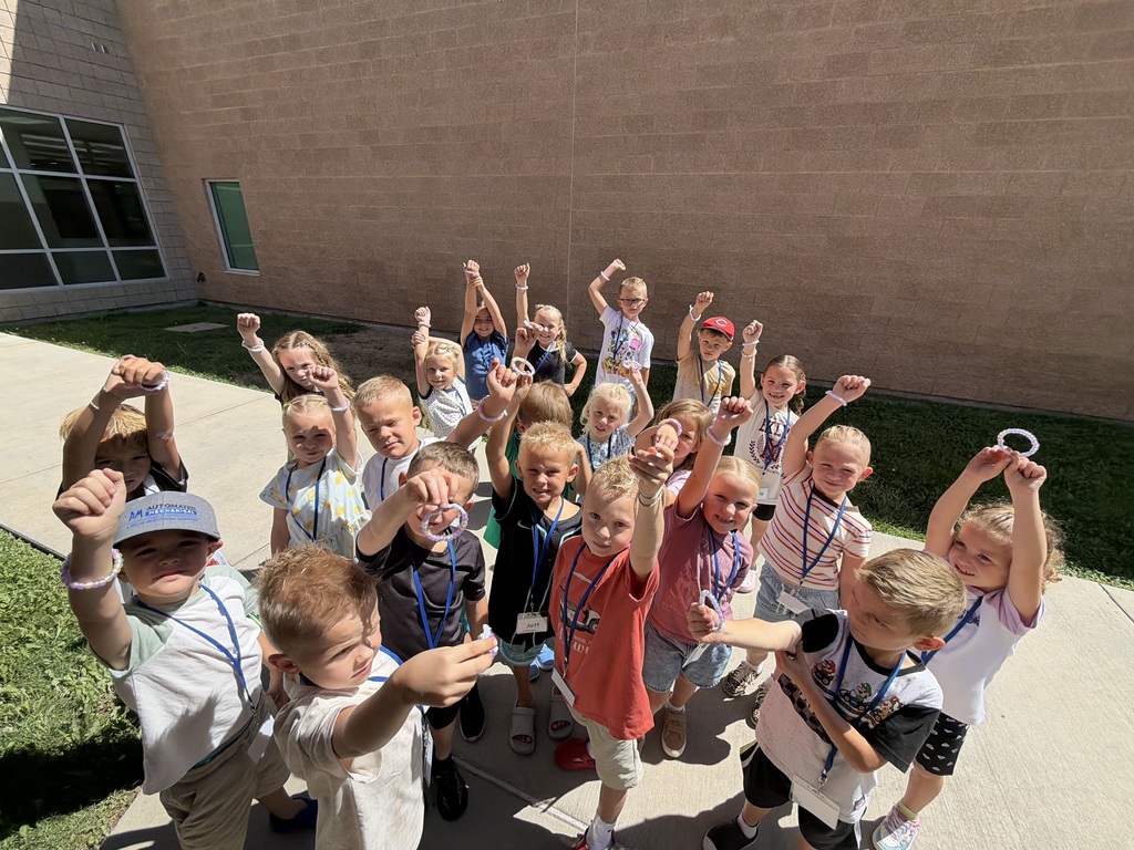 Mrs. Wentz's class full of students putting up their bracelets they made