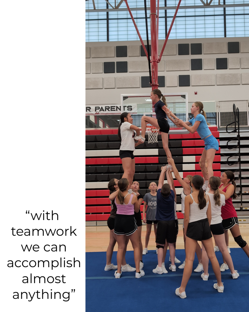 photograph of roy jr cheerleaders at practice working on a stunt 'with team work we can accomplish almost anything'