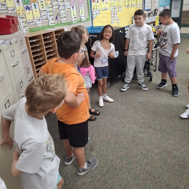 kids playing a game in a circle
