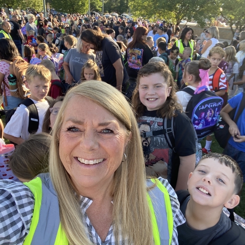 Mrs. Anderson taking a selfie of her and the whole school outside on the first day