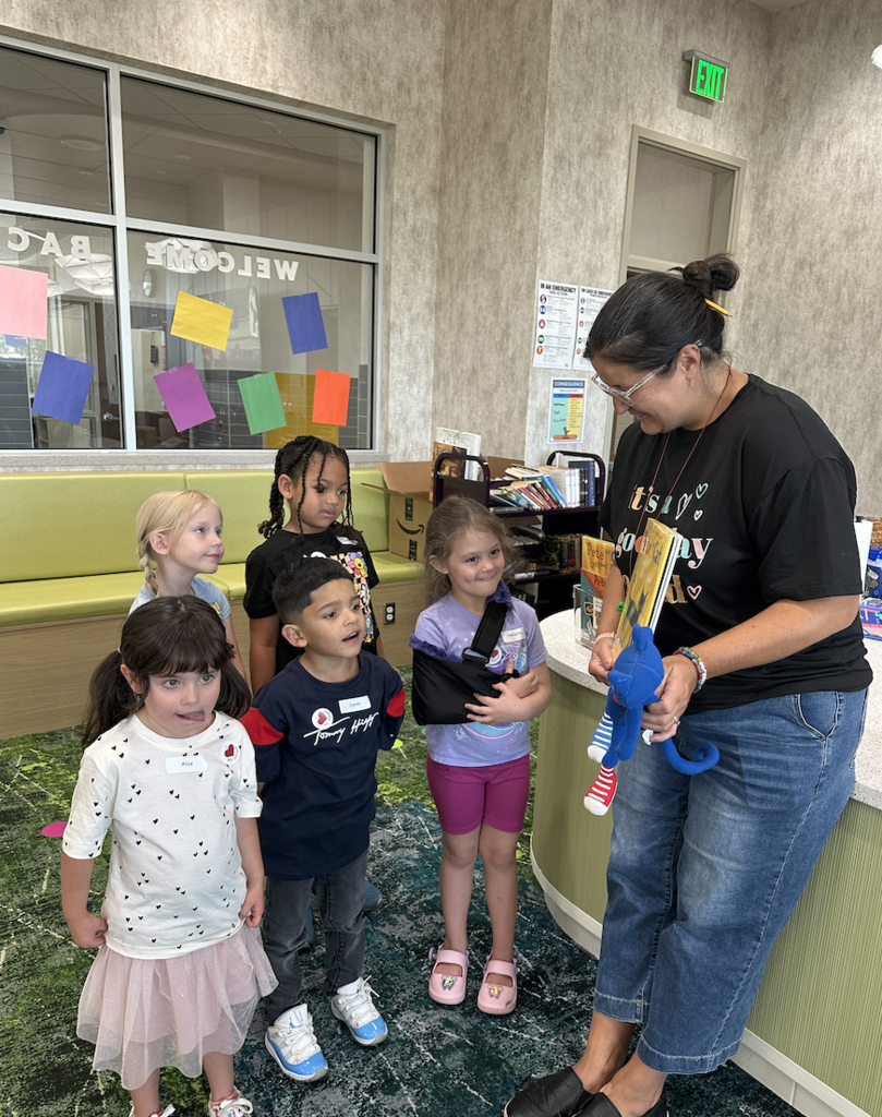 small group of students meeting the school librarian