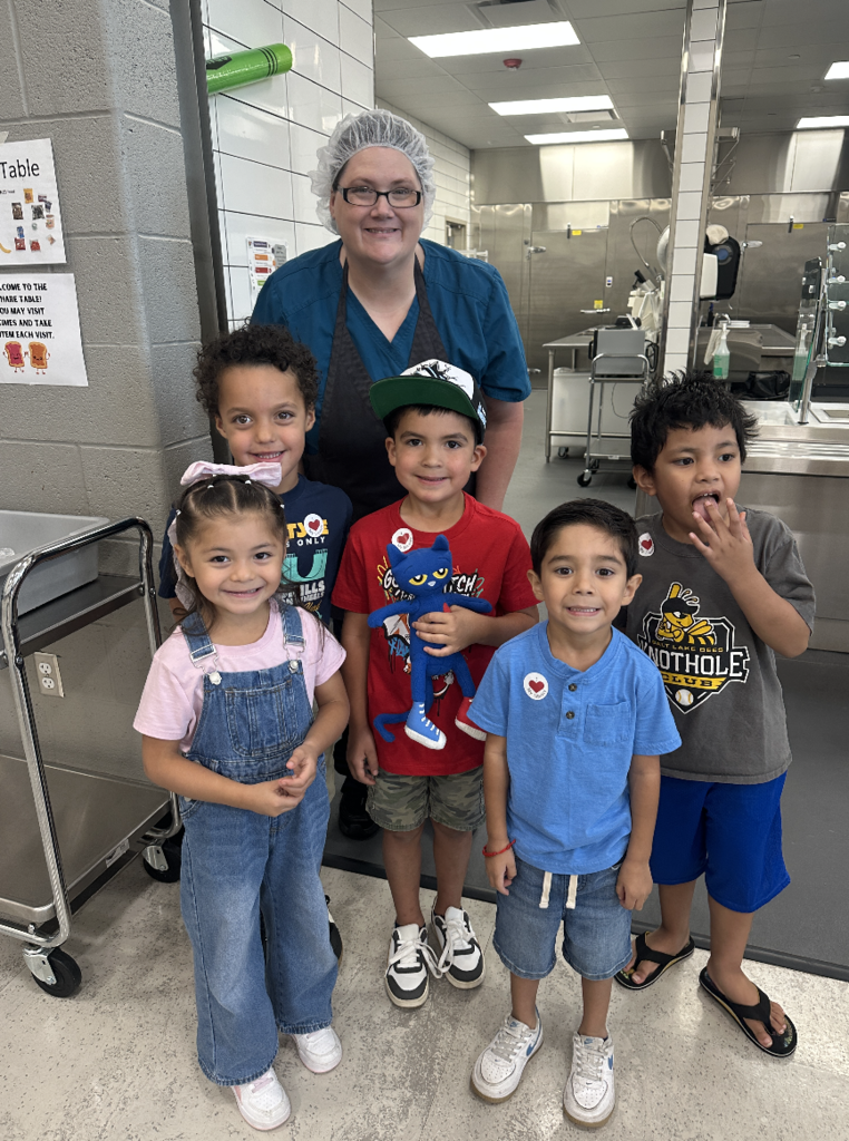 group of students with the nutrition service worker