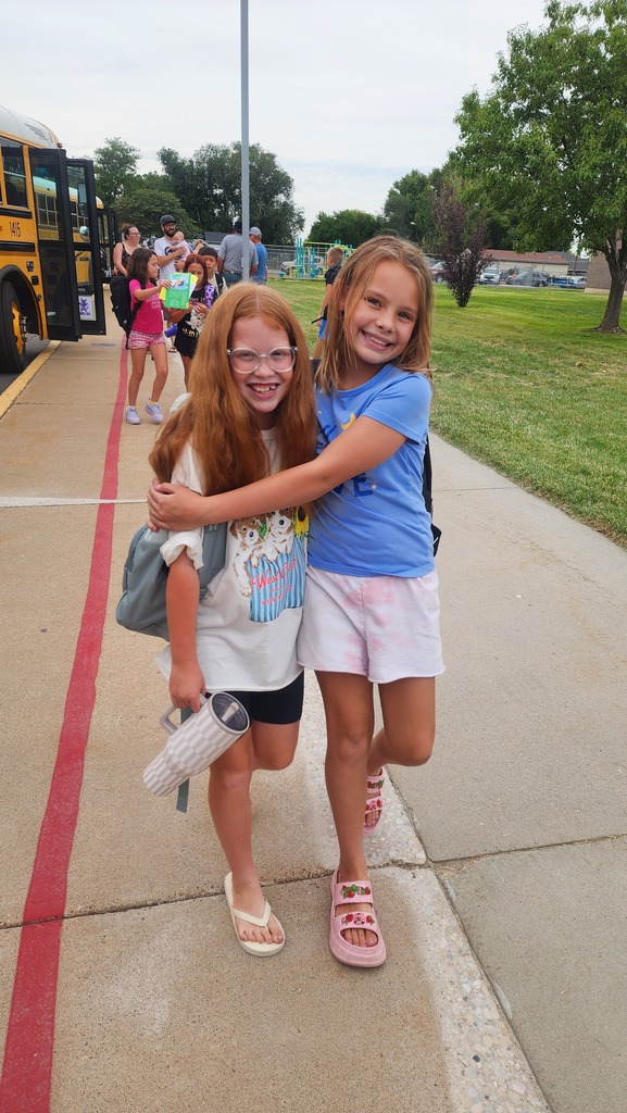 two students smiling