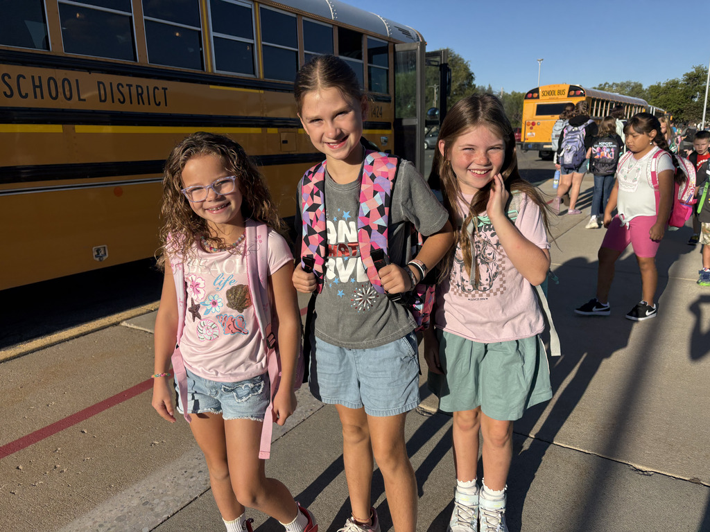 3 students smiling
