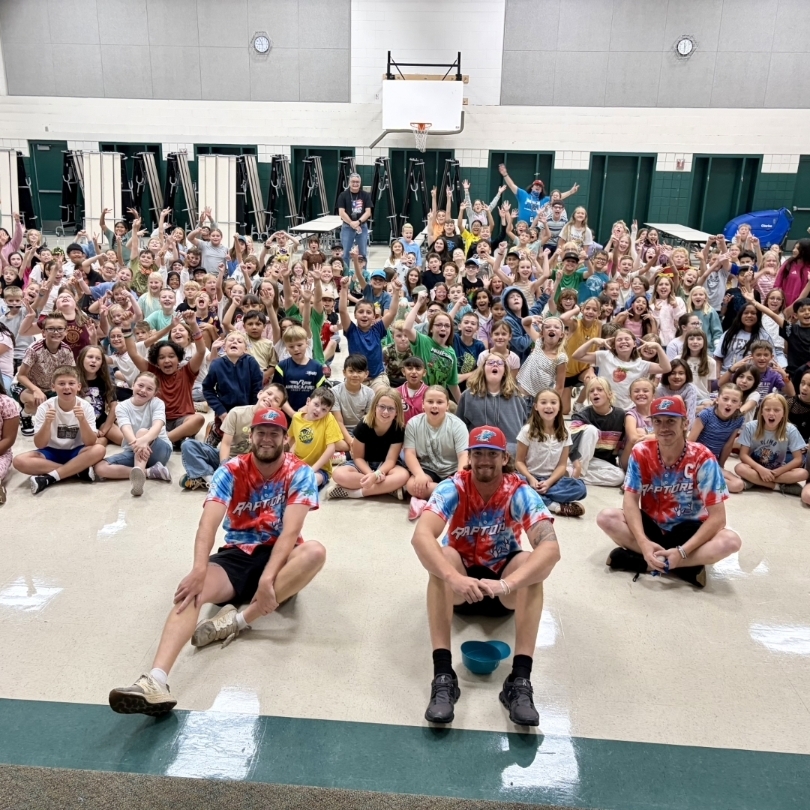 Ogden Raptor team members in front of the students at Majestic 