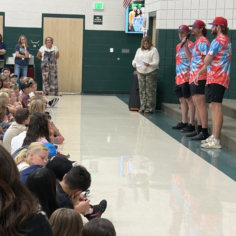 Ogden Raptor team members talking to students
