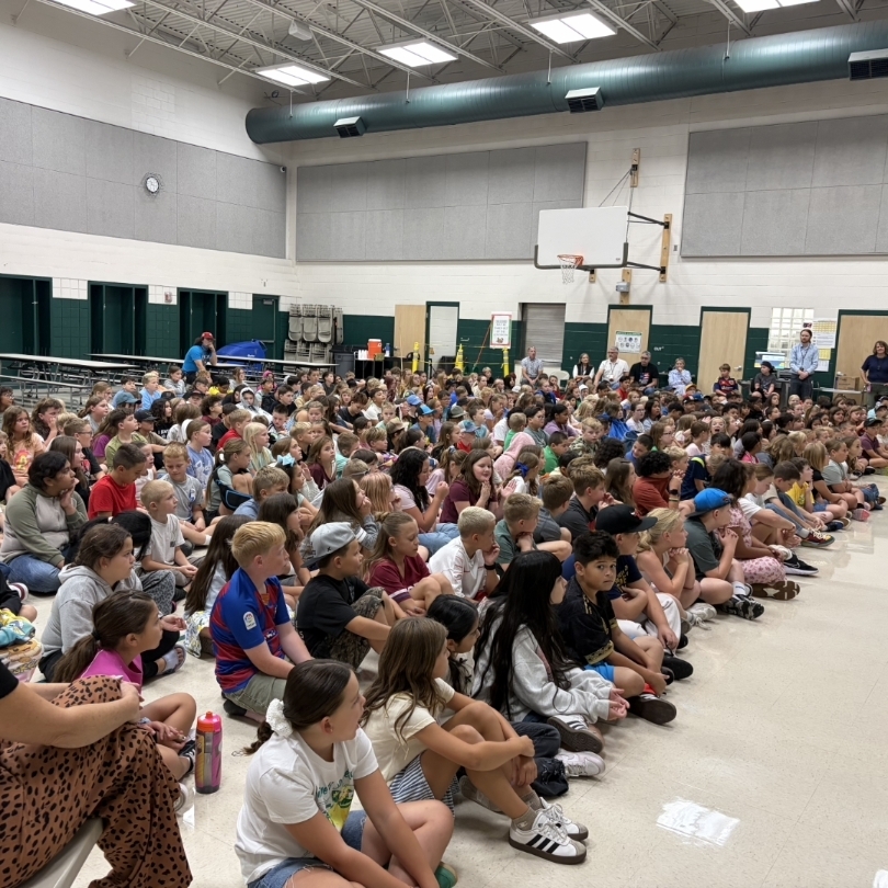 students listening to Ogden Raptor team members 