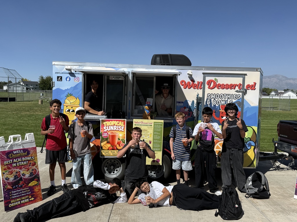 picture of students with a food truck