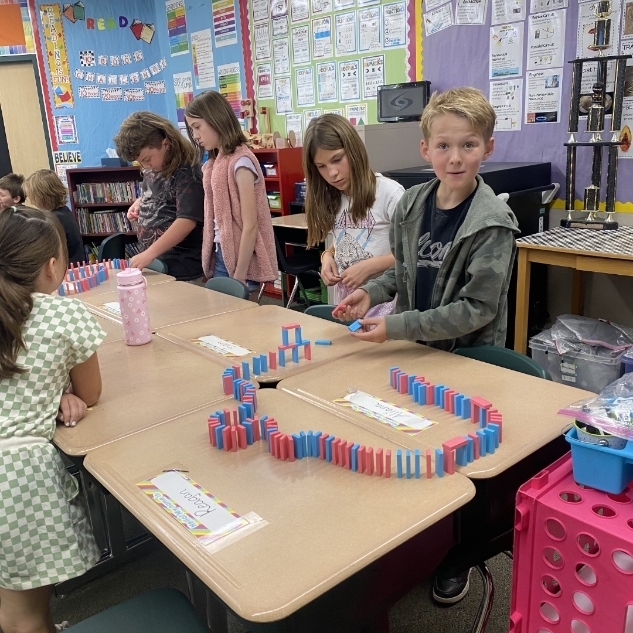 kids ding a science experiment with blocks