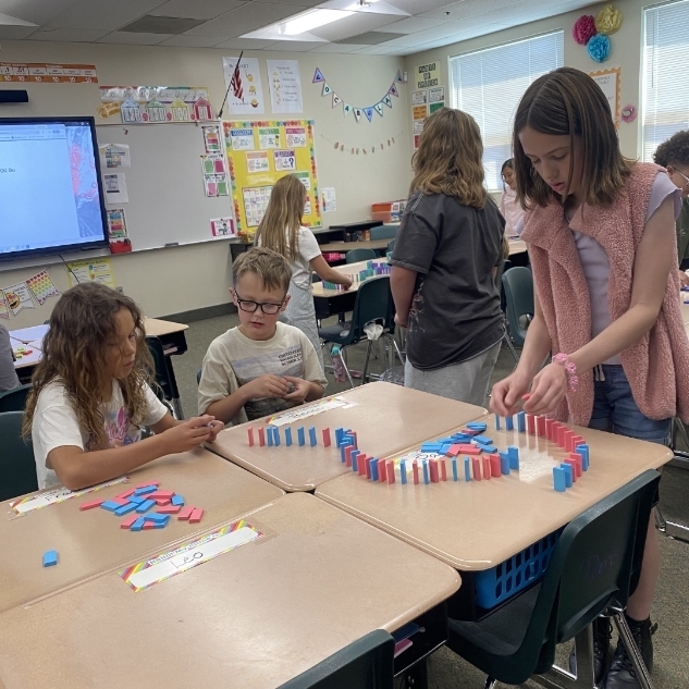 kids ding a science experiment with blocks