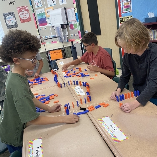 kids ding a science experiment with blocks