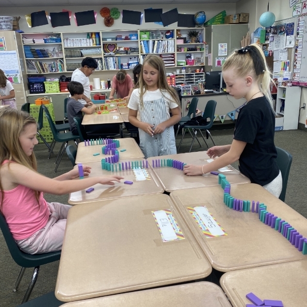 kids ding a science experiment with blocks