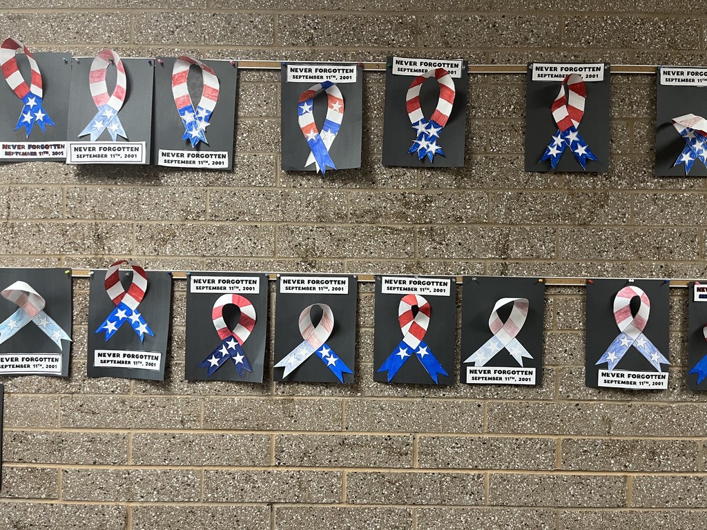 6th grade made art ribbons saying "never forget" 