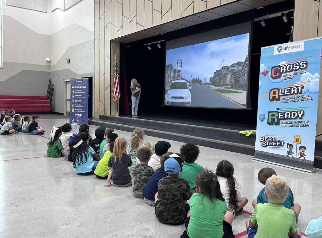 students in an assembly with safe routes utah