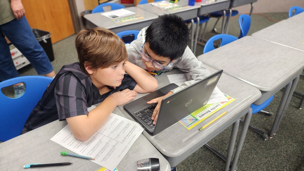 students working on computer