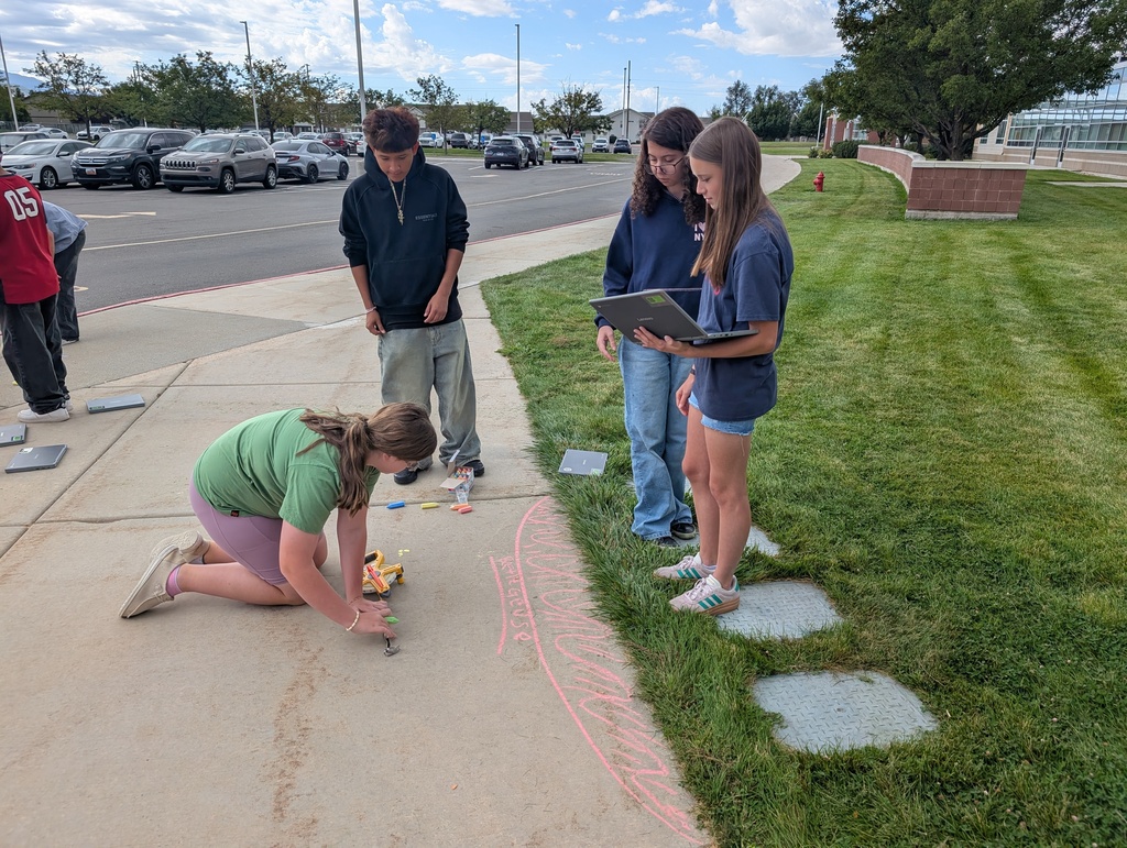 Drawing stars to scale. Outside with chalk for one day and then indoors for day 2. They also studied the colors of a flame and how it relates to stars.