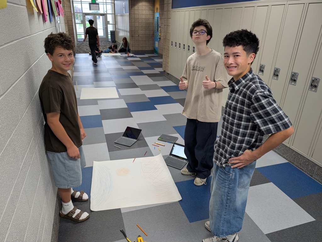 Drawing stars to scale. Outside with chalk for one day and then indoors for day 2. They also studied the colors of a flame and how it relates to stars.