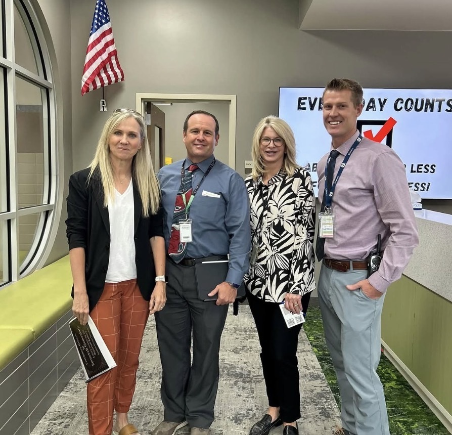 school administration posing with Katy Hall