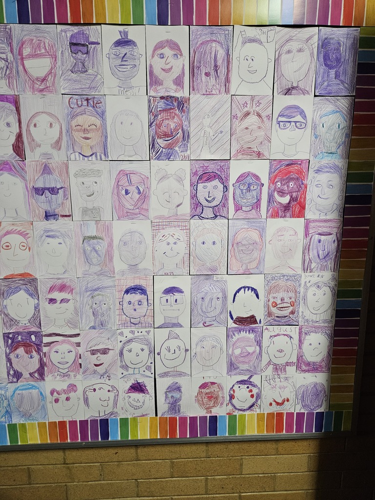 Close-up section of the bulletin board showing self-portraits drawn in shades of purple and violet.