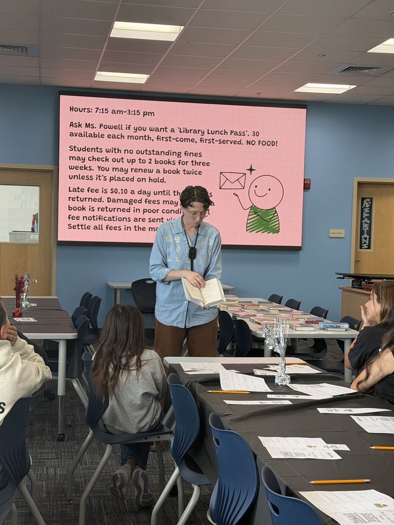 Librarian talks with students