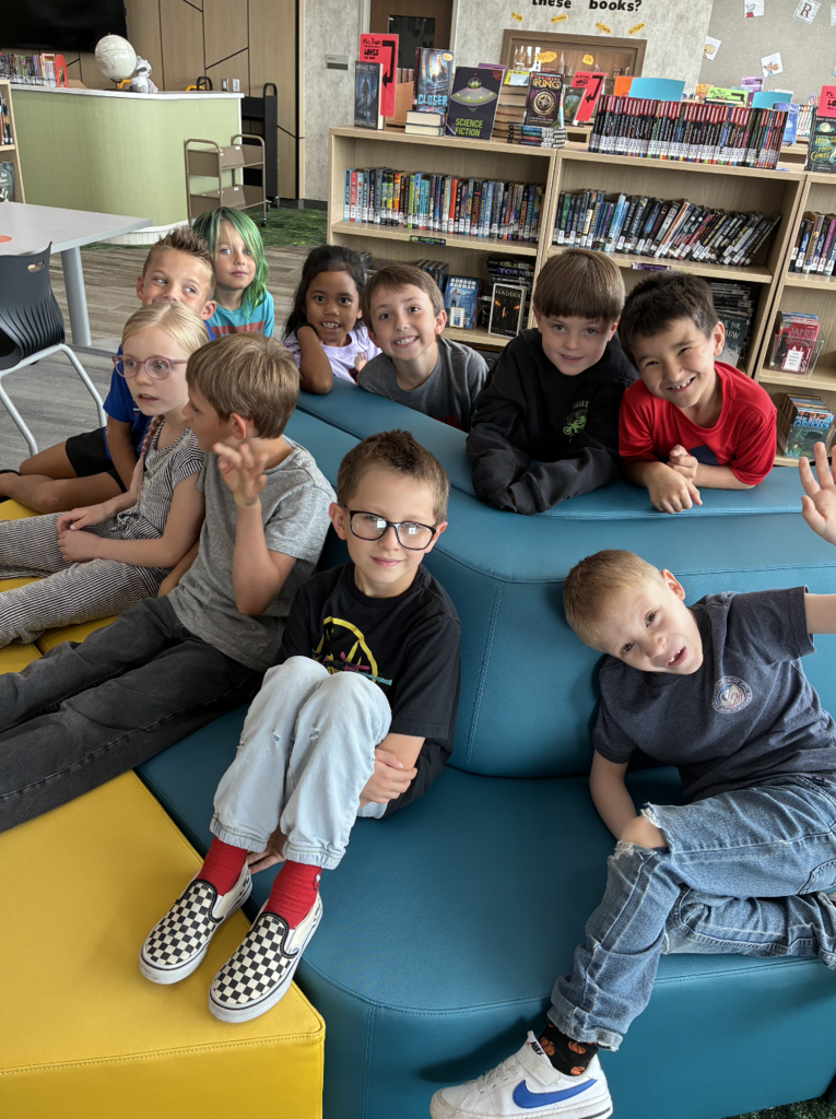 a group of students sitting on a bench