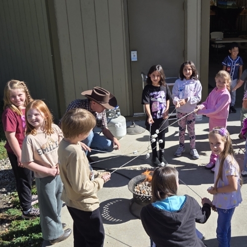 kids roasting marshmallows.