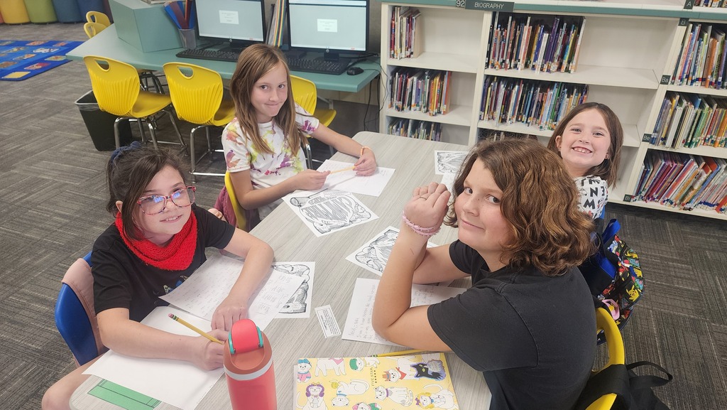 students posing while writing