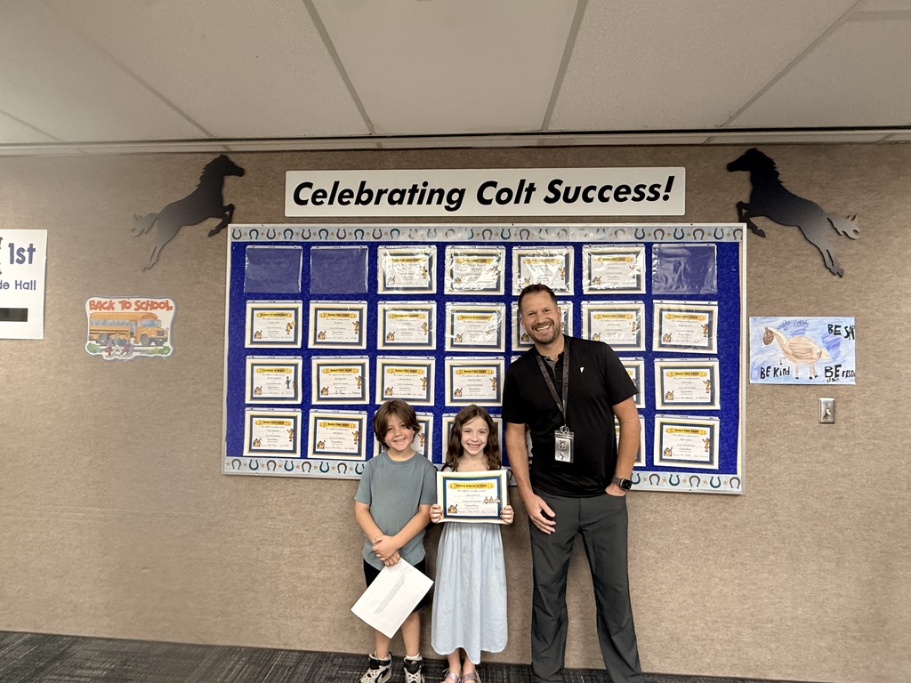 Colt Success picture of students and principal
