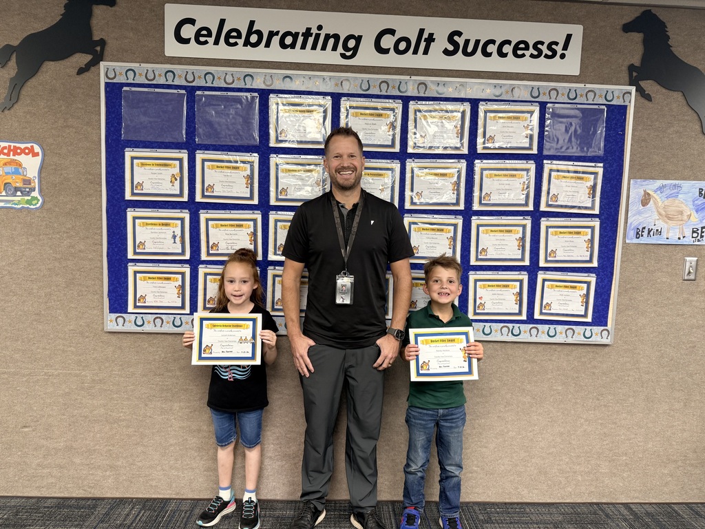 Colt Success picture of students and principal
