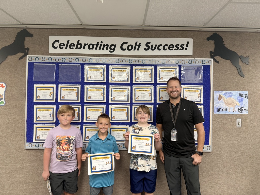 Colt Success picture of students and principal