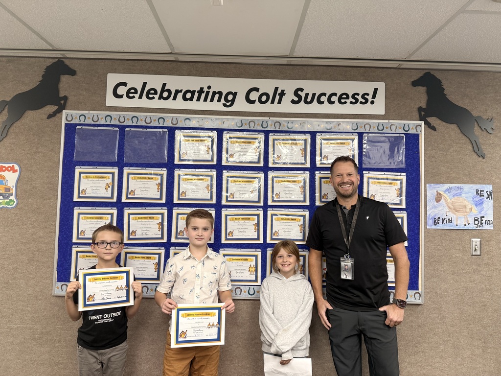 Colt Success picture of students and principal