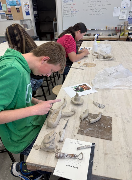 Student Scuplts Clay