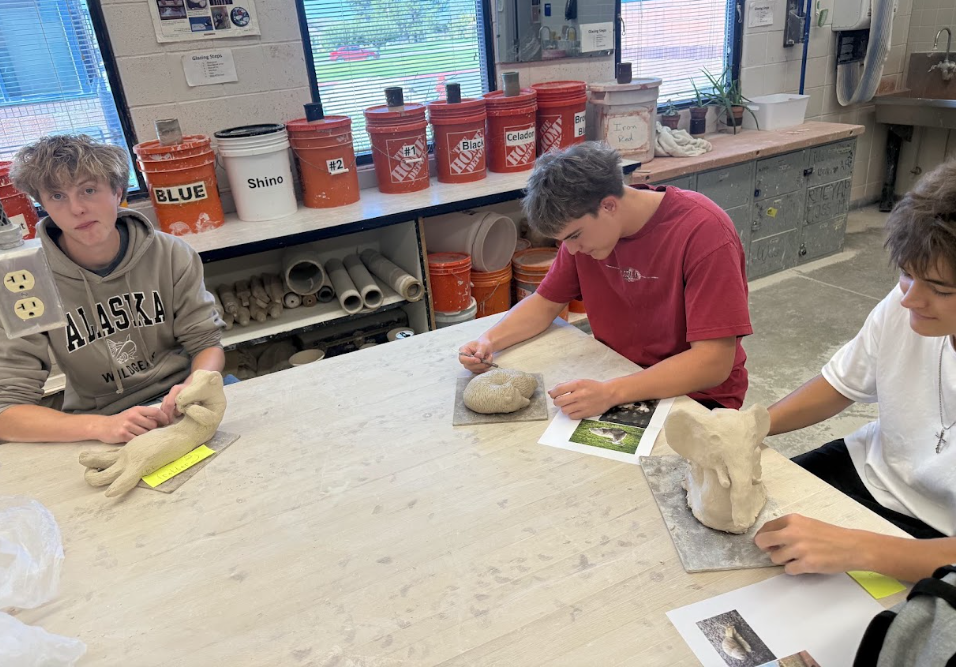 Student Sculpts Clay