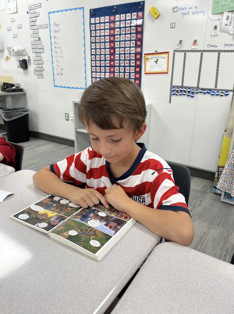 student reading at a desk
