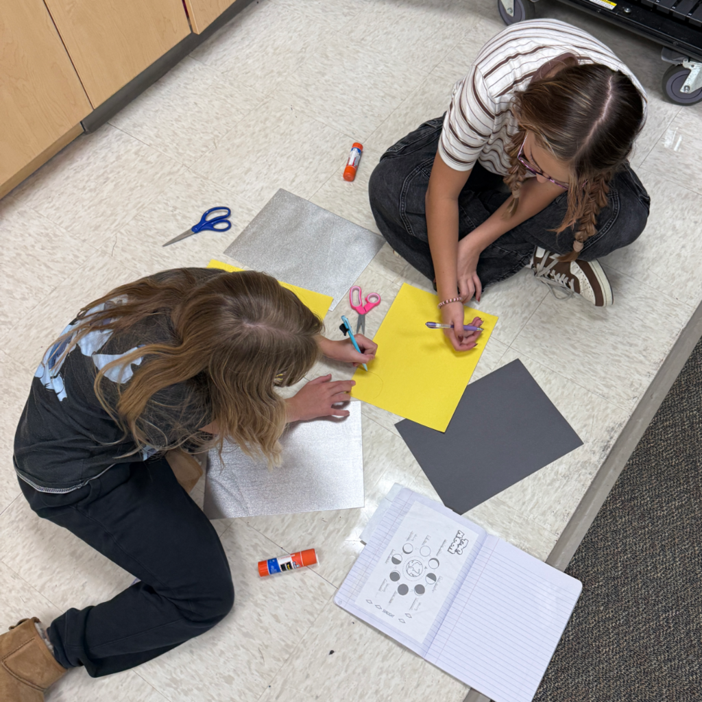 Students with their moon phase models.
