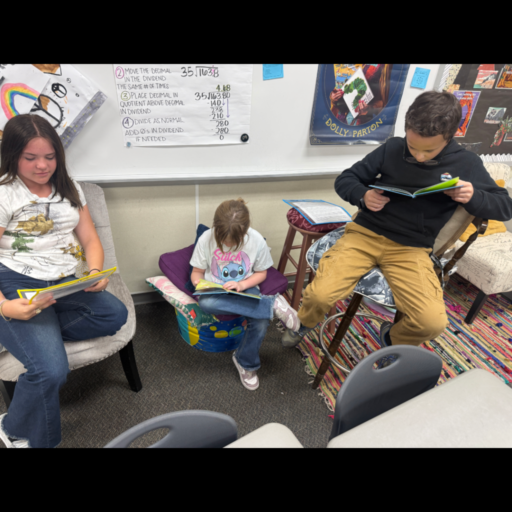 Students reading books with each other.