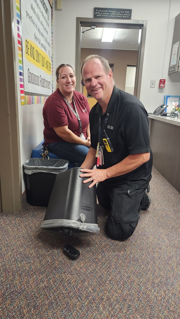 custodian pretending to catch a "mouse"